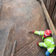 A MOLA archaeologist brushes off the exterior of the ice house.